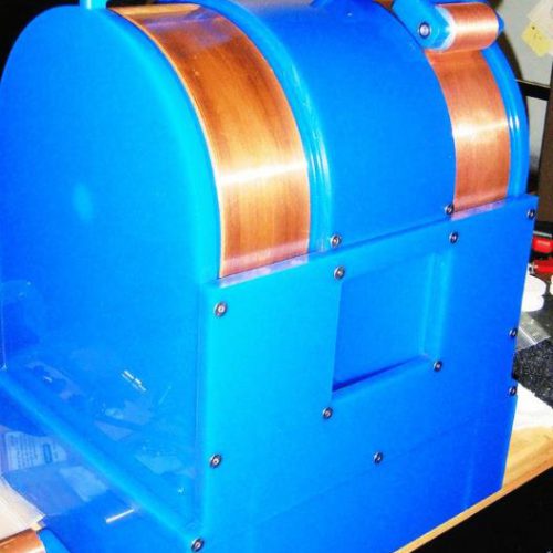 A blue machine with copper  